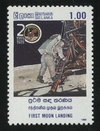 Item no. S352 (stamp)
Type: stamp
Country: Sri Lanka
Date of issue: 10 November 1989
Catalog number: Scott no. 935 (of 934 – 937)
Stamp (II) of a 4-stamp set commemorating 20th anniversary of the first manned Moon landing by US APOLLO 11 mission. It shows reproduction of a photograph taken by the mission (1969) commander NEIL ARMSTRONG of EDWIN “BUZZ” ALDRIN descending a ladder from the Lunar Module (LM) “EAGLE”.
Item no. S352 (stamp).jpg