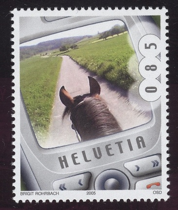 Item no. S452 (stamp)
Type: stamp
Country: Switzerland
Date of issue: 6 September 2005
Catalog number: Scott no. 1217 (of 1217 – 1220)
Stamp (I) of a 4-stamp set presenting photographs taken by cameras built in cell phones. It shows reproduction of a photograph “On horseback” taken by Brigit ROHRBACH. It’s the world-first postal issue of MMS. The 4 photographs were selected from over 3300 photographs submitted by general public in the “Swiss mobil – a country on the move” competition.
Item no. S452 (stamp).jpg