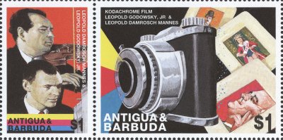 Item no. S217 (stamp)
Type: stamp
Country: Antigua & Barbuda
Date of issue: 10 November 1998
Catalog number: Scott 2181f (of 2181a – 2181h)
2 linked stamps of a 8-stamp set INVENTORS. Both of them honor two Jewish musicians and amateur chemists – Leopold Godowsky, Jr. and Leopold Damrosch Mannes, who in 1935 invented the first practical color film for transparencies, Kodachrome.
The stamps show (I) graphic representation of portraits of the inventors, based on real photograph (+ their names); and (II) graphic image of a camera and framed slides (+ names of the inventors).
The portrait of the inventors is a graphic representation of a photograph (transparency) taken in 1938 by Dr. Walter Clark (1899 - 1991), English scientist, one of pioneers of invisible radiation (infrared) photography.
Item_no._s217__stamp_.jpg