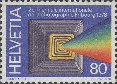 Item no. S43 (stamp)
Type: stamp
Country: Switzerland
Date of issue: 9 March 1978
Catalog number: Michel 1119 (of 1116 – 1119), Scott 655 (of 652 – 655)
Stamp commemorating the 2nd International Triennial of Photography in Fribourg. It shows a stylized front of a bellows camera.
Part of a 4-stamp set. Other stamps of the set not relevant to photography.
Item_no._s43__stamp_.jpg